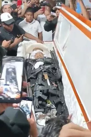 the casket of Manuel Julian Sevillano Bustamante, 39, at his funeral, in Guayaquil, Ecuador